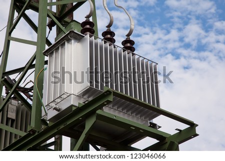 Electricity distribution transformer with cooling ribs - stock photo