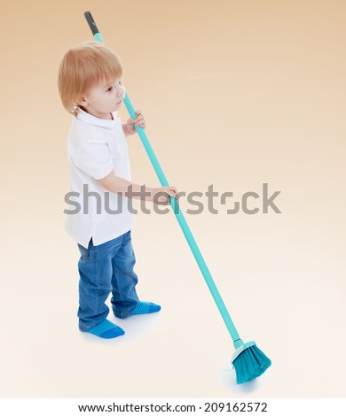 stock-photo-boy-sweeping-brush-happy-childhood-and-rest-concept-209162572.jpg