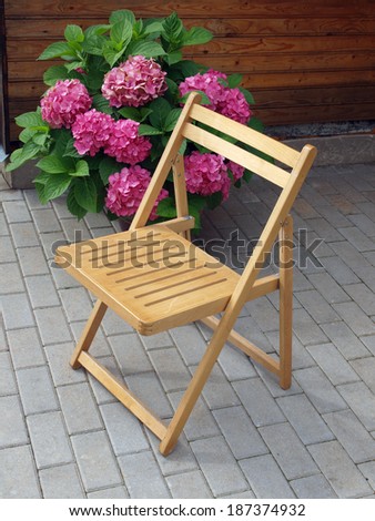 Folding wooden garden chair for rest outdoor - stock photo