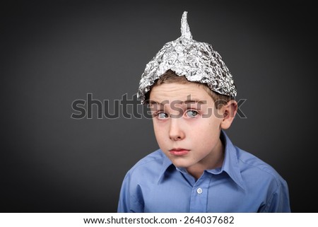 stock-photo-boy-in-a-tin-foil-hat-looking-up-264037682.jpg