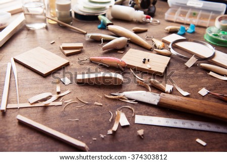 . Wood carving. Making handcrafted fishing lures form balsa wood