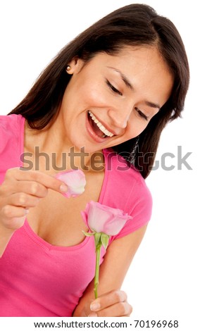 Woman with a flower thinking he loves me, he loves me not - isolated - - stock-photo-woman-with-a-flower-thinking-he-loves-me-he-loves-me-not-isolated-70196968