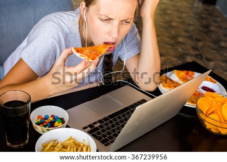 unhealthy eating computer lifestyle shutterstock fast works woman