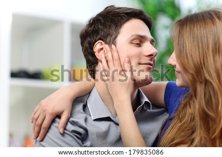 http://thumb9.shutterstock.com/display_pic_with_logo/1335553/179835086/stock-photo-pretty-woman-stroking-the-cheek-of-her-boyfriend-with-love-179835086.jpg