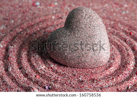  - stock-photo-grey-zen-stone-in-shape-of-heart-on-sand-background-160758536