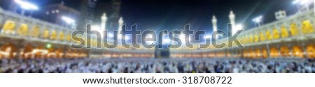 Muslim pilgrims circumambulate the Kaaba after dawn prayer at Masjidil Haram in Makkah, Saudi Arabia in panorama blurred background. for Islamic, hajj concept - stock photo