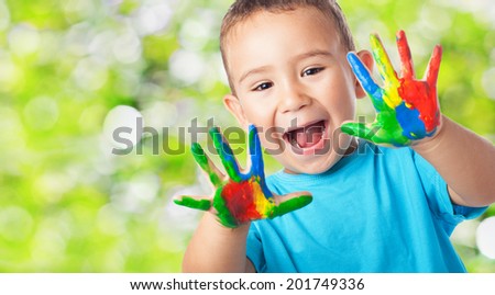 portrait of cute <b>kid playing</b> with paint - stock photo - stock-photo-portrait-of-cute-kid-playing-with-paint-201749336