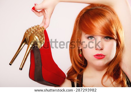 Fashion girl with red high <b>heel shoes</b> stiletto boots with gold studs. - stock-photo-fashion-girl-with-red-high-heel-shoes-stiletto-boots-with-gold-studs-women-loves-shoes-concept-287293982