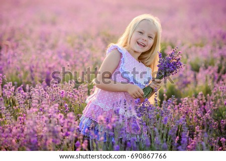 http://thumb9.shutterstock.com/display_pic_with_logo/175763472/690867766/stock-photo-beautiful-girl-in-a-field-of-lavender-on-sunset-beautiful-girl-in-amazing-dress-walk-on-the-field-690867766.jpg