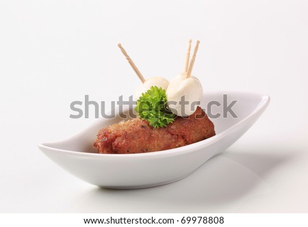 minced meat kebab and baby traditional balkanian meet pan roasted