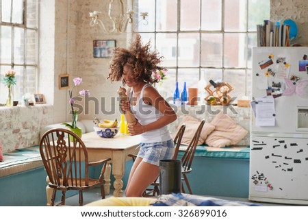 http://thumb9.shutterstock.com/display_pic_with_logo/238468/326899016/stock-photo-happy-curly-haired-girl-dancing-in-kitchen-wildly-hair-bouncing-wearing-pajamas-at-home-photos-on-326899016.jpg