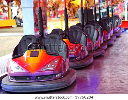IMPROVING  THE HEAD LIGHTS OF LOGAN / VERITO Stock-photo-a-row-of-dodgem-cars-on-a-fun-fair-amusement-ride-39758284