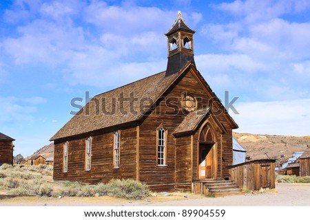 stock-photo-an-old-wooden-church-located-in-an-old-west-ghost-town-89904559.jpg