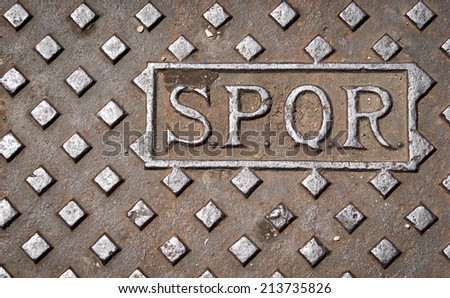 stock-photo-a-manhole-drain-cover-in-rom