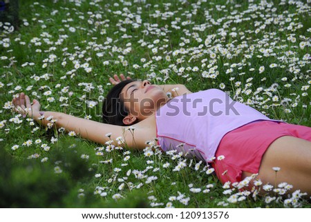 http://thumb9.shutterstock.com/display_pic_with_logo/258064/120913576/stock-photo-beautiful-young-latin-woman-enjoying-and-lying-down-on-a-flowers-120913576.jpg