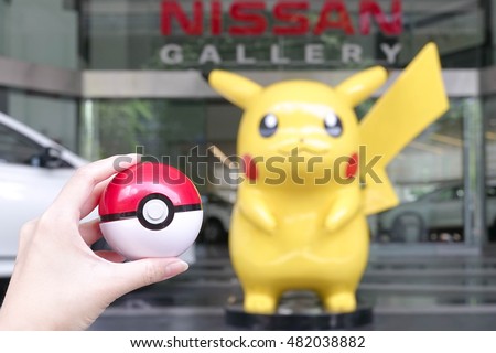 pikachu holding a pokeball