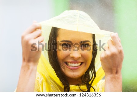 stock-photo-happy-young-woman-in-poncho-