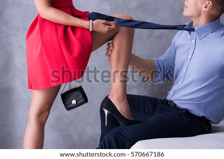 http://thumb9.shutterstock.com/display_pic_with_logo/277009/570667186/stock-photo-woman-in-red-dress-flirting-with-the-man-wearing-tie-and-elegant-shirt-570667186.jpg
