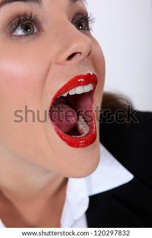 stock-photo-portrait-of-woman-with-mouth-open-120297832.jpg
