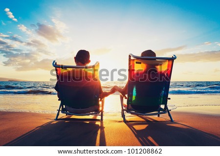 People Relaxing On The Beach Sunset