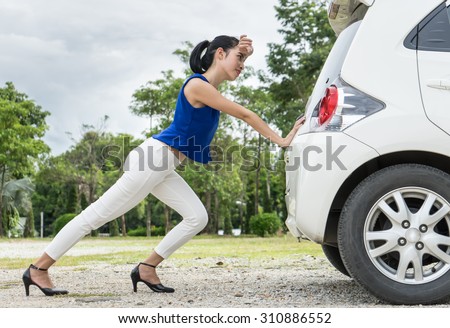 stock-photo-woman-push-the-car-was-broke