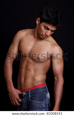 Indian young fitness man posing to the camera. - stock photo Indian young fitness man posing to the camera. - stock photo