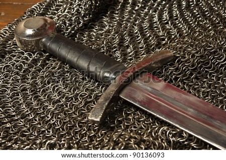 stock-photo-still-life-with-medieval-sword-and-hauberk-90136093.jpg