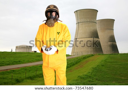 stock-photo-a-police-man-or-security-guard-in-a-yellow-rain-suit-or-anti-radiation-suit-is-worried-about-the-73547680.jpg