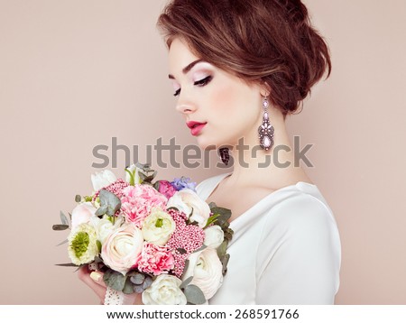 http://thumb9.shutterstock.com/display_pic_with_logo/493354/268591766/stock-photo-woman-with-bouquet-of-flowers-in-her-hands-flowers-spring-bride-march-fashion-photo-268591766.jpg