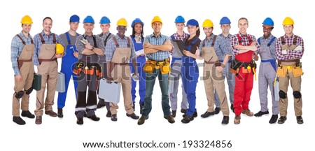 Length Portrait Of A Confident Manual Worker Holding Length Portrait Of A Confident Manual Worker Holding