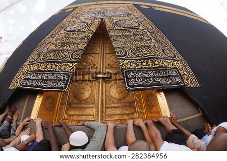 MECCA, SAUDI ARABIA-CIRCA MAY 2015: A close up view of Kaaba door at Masjidil Haram on MAY, 2015 in Makkah, Saudi Arabia. The door is made of pure gold. - stock photo