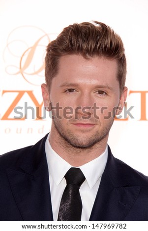 - stock-photo-jesse-spencerlos-angeles-jul-travis-wall-arrives-at-the-rd-annual-celebration-of-dance-gala-147969782