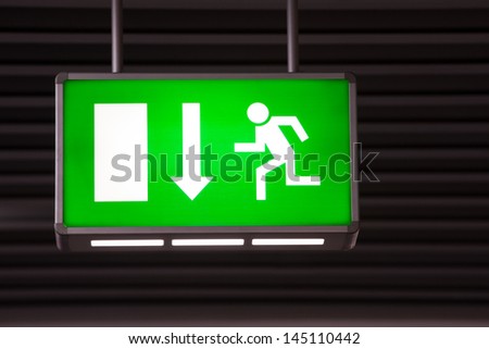 Lighting color and entity? Stock-photo-illuminated-green-exit-sign-attached-to-the-ceiling-in-a-public-transportation-facility-signage-145110442