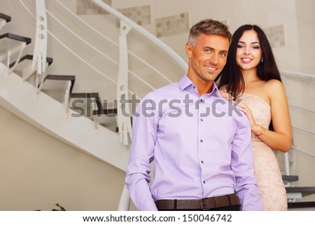 stock photo romantic young couple embracing in living room 150046742