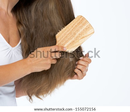 Woman Combing Hair Stock Photos, Images, & Pictures 