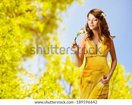 http://thumb9.shutterstock.com/display_pic_with_logo/604900/189596642/stock-photo-woman-smelling-flowers-spring-portrait-of-beautiful-girl-in-yellow-dress-189596642.jpg
