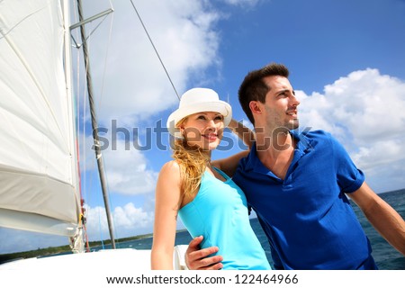stock photo smiling rich young couple on a sailboat in caribbean sea 122464966