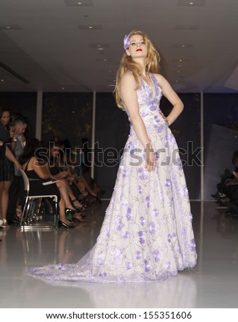  - stock-photo-new-york-september-model-walks-runway-during-expo-latino-show-for-richard-quinones-collection-155351606
