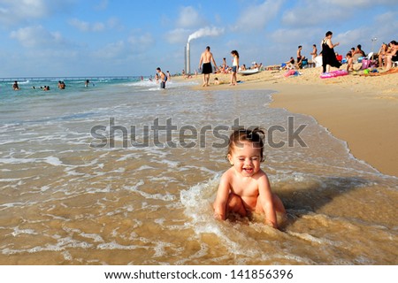  - stock-photo-zikim-isr-july-baby-talya-ben-ari-age-in-zikim-beach-near-rutenberg-power-station-on-july-141856396