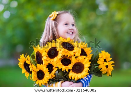 http://thumb9.shutterstock.com/display_pic_with_logo/683398/321640082/stock-photo-happy-laughing-little-girl-holding-sunflower-bouquet-child-playing-with-sunflowers-kids-picking-321640082.jpg