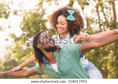 http://thumb9.shutterstock.com/display_pic_with_logo/76219/258017492/stock-photo-cute-couple-in-the-park-on-a-sunny-day-258017492.jpg