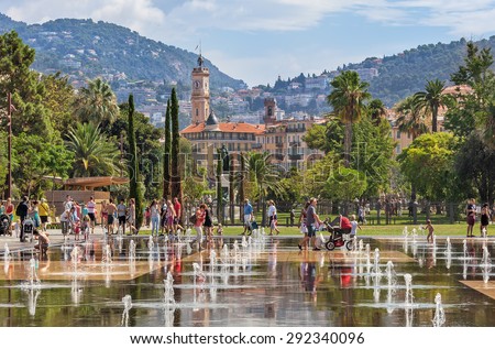 stock-photo-nice-france-august-people-among-fountains-at-promenade-du-paillon-hectares-km-292340096.jpg