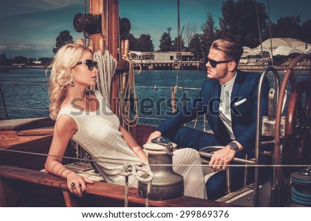 stock photo stylish wealthy couple on a luxury yacht 299869376