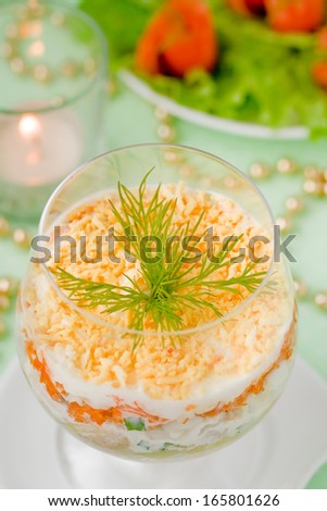 Cod liver salad with eggs, carrots, cheese, onions and potatoes. Salad ...