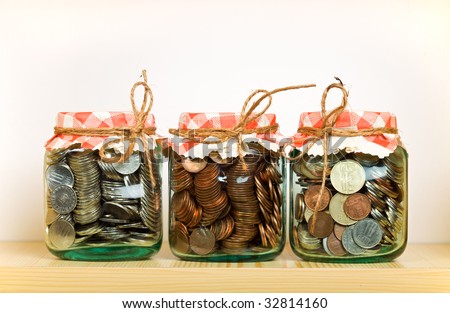 away put saving money inflation wealth preservation fund takes jars coins shelf concept glass schroders shutterstock