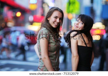 http://thumb9.shutterstock.com/display_pic_with_logo/85716/85716,1302879875,2/stock-photo-two-beautiful-young-women-at-times-square-in-new-york-city-shallow-dof-75312079.jpg