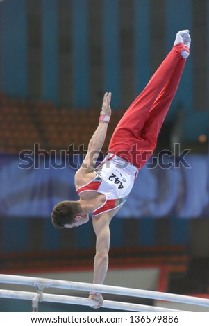  - stock-photo-moscow-russia-april-pascal-bucher-switzerland-performs-exercise-on-parallel-bars-in-final-136579886
