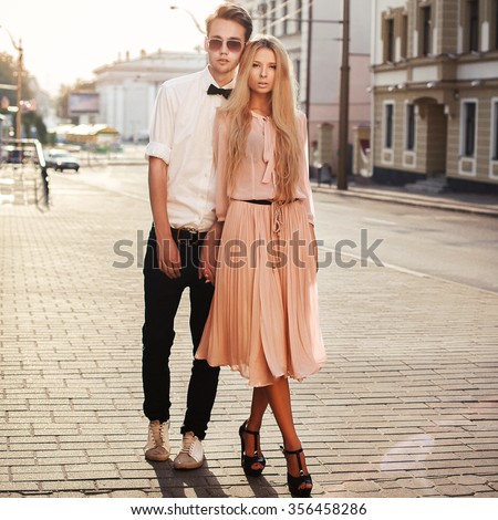 http://thumb9.shutterstock.com/display_pic_with_logo/952708/356458286/stock-photo-young-beautiful-fashion-hipster-couple-in-love-posing-outdoor-on-the-street-standing-together-356458286.jpg