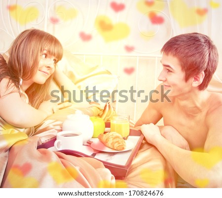 http://thumb9.shutterstock.com/display_pic_with_logo/96482/170824676/stock-photo-valentine-s-day-concept-happy-man-and-woman-having-luxury-hotel-breakfast-in-bed-together-170824676.jpg