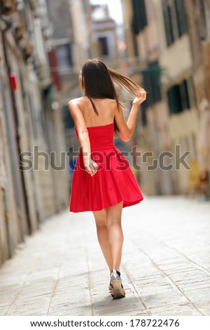 http://thumb9.shutterstock.com/display_pic_with_logo/97565/178722476/stock-photo-woman-in-red-dress-walking-in-street-in-venice-italy-cheerful-and-happy-in-rear-view-showing-back-178722476.jpg